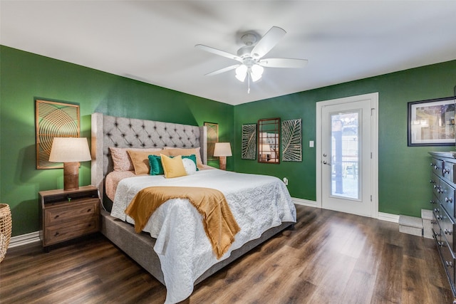 bedroom featuring ceiling fan, dark hardwood / wood-style floors, and access to outside