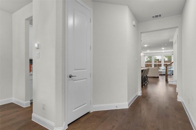 hall with dark hardwood / wood-style flooring