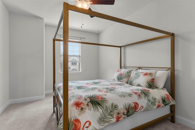 bedroom with light carpet and ceiling fan