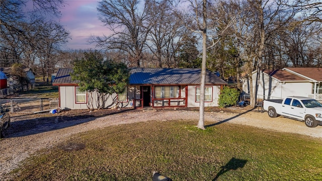 view of front of home with a yard