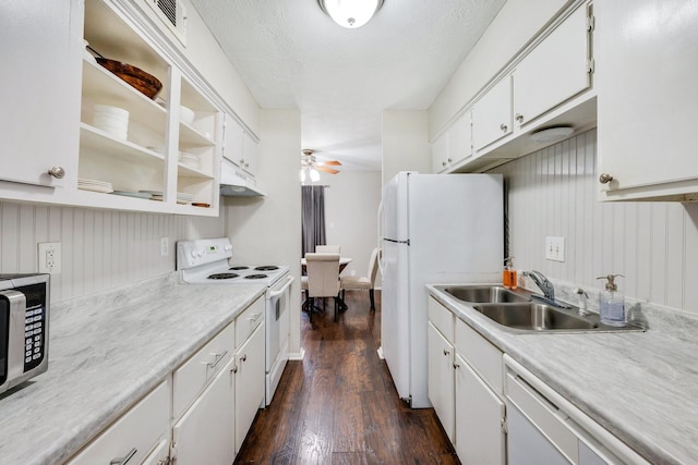 kitchen with white cabinetry, sink, ceiling fan, dark hardwood / wood-style flooring, and white appliances