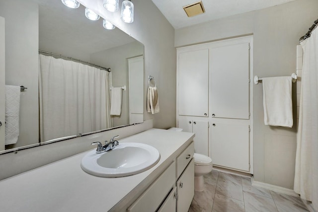 bathroom with vanity and toilet