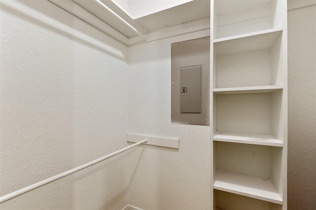 spacious closet featuring electric panel