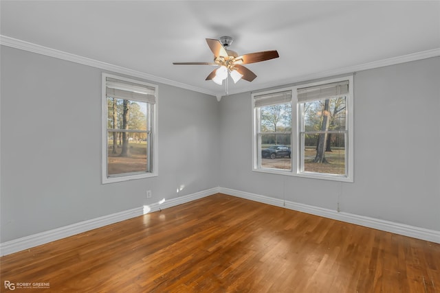 unfurnished room featuring ceiling fan, ornamental molding, and wood-type flooring