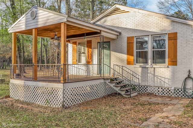 view of property exterior featuring ceiling fan