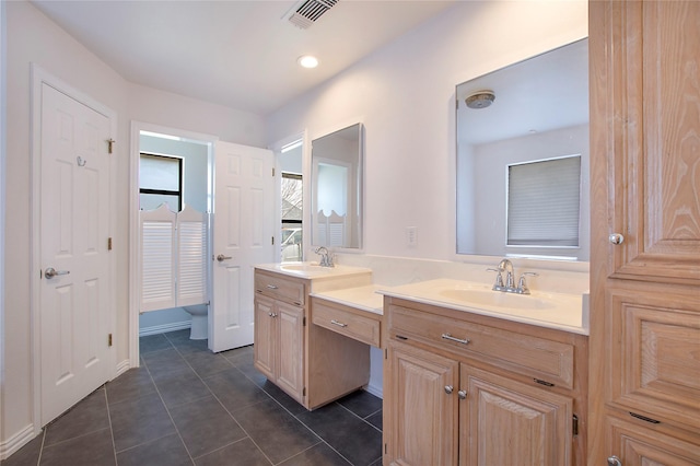 bathroom with vanity and tile patterned floors