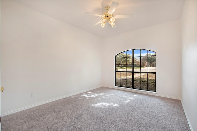 spare room featuring ceiling fan and carpet flooring