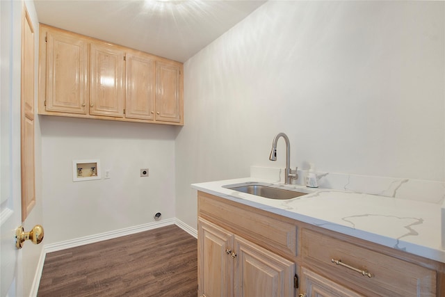 washroom with hookup for an electric dryer, hookup for a washing machine, dark hardwood / wood-style flooring, cabinets, and sink