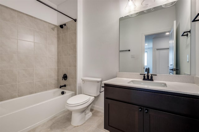 full bathroom with toilet, tiled shower / bath combo, tile patterned flooring, and vanity