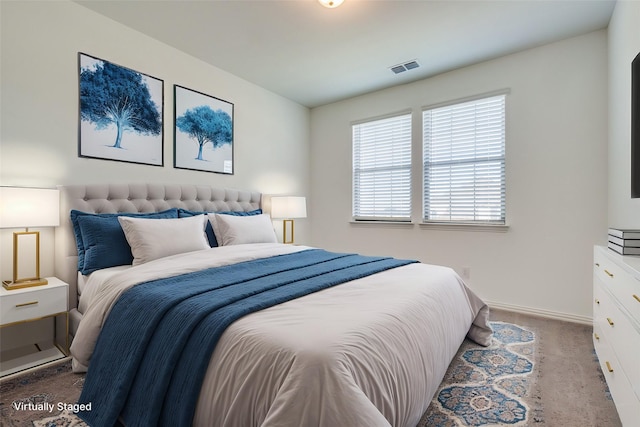 bedroom featuring light carpet