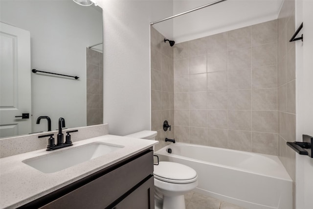 full bathroom featuring tile patterned floors, toilet, vanity, and tiled shower / bath