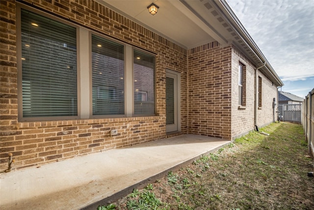 entrance to property featuring a patio area