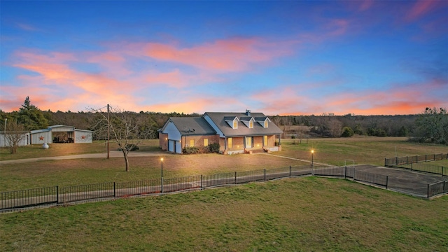 view of front of property featuring a garage and a lawn