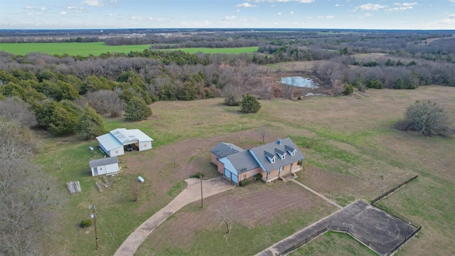 birds eye view of property with a water view and a rural view