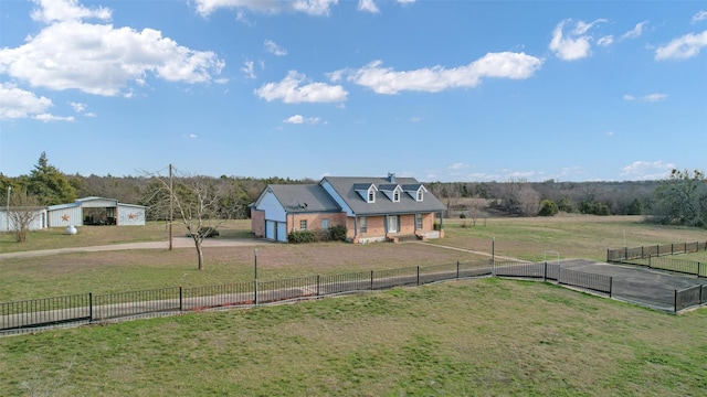 view of yard with a garage and a rural view