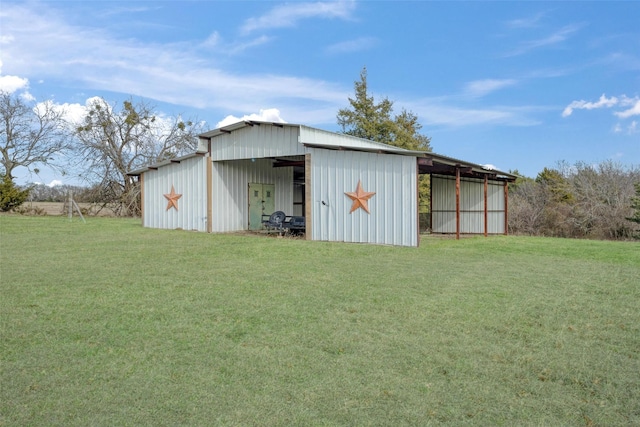 view of outbuilding featuring a lawn