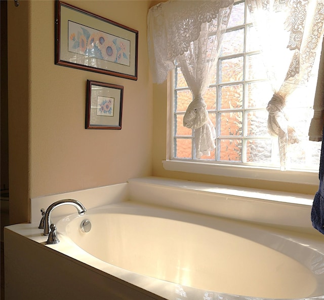 bathroom featuring a tub to relax in