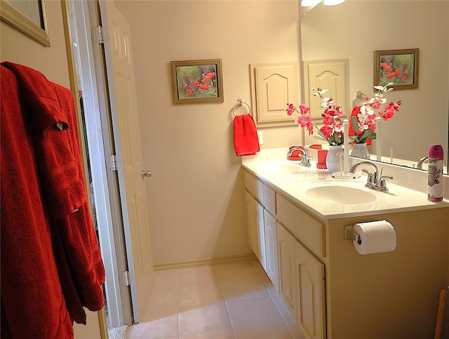 bathroom with tile patterned flooring and vanity