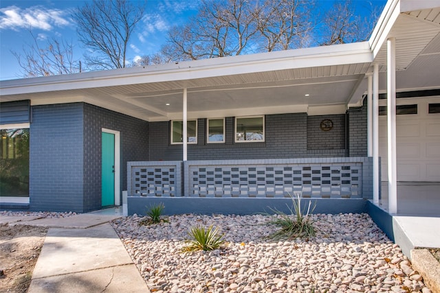 doorway to property with a porch