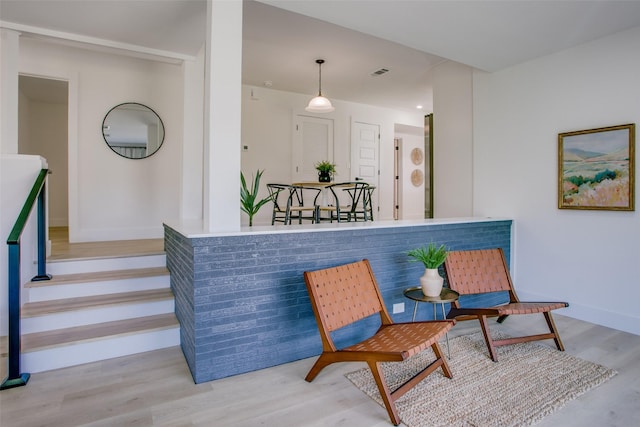 sitting room with hardwood / wood-style flooring