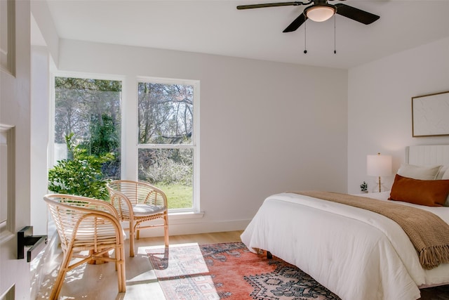 bedroom featuring ceiling fan and hardwood / wood-style floors