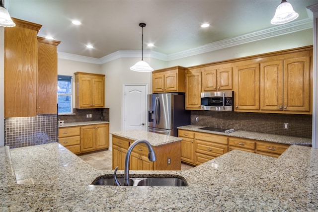 kitchen featuring pendant lighting, light stone counters, appliances with stainless steel finishes, and sink