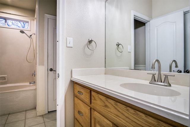 bathroom featuring tile patterned floors, vanity, and shower / bath combination