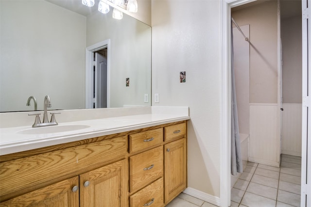 bathroom featuring vanity, tile patterned floors, and shower / bathtub combination