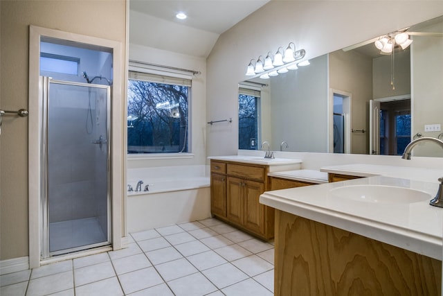 bathroom featuring tile patterned floors, vanity, lofted ceiling, and independent shower and bath