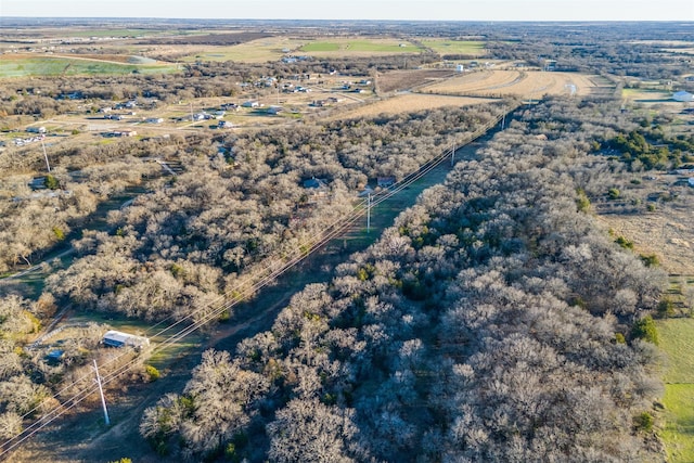 birds eye view of property with a rural view