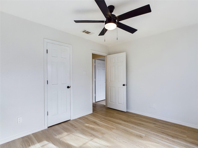 unfurnished bedroom featuring ceiling fan and light wood-type flooring