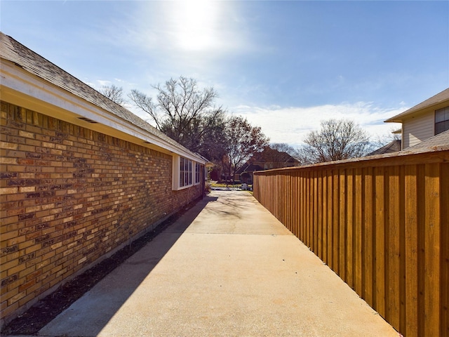 view of side of property with a patio area