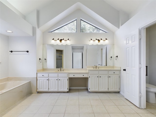 bathroom with high vaulted ceiling, a bathing tub, vanity, tile patterned floors, and toilet