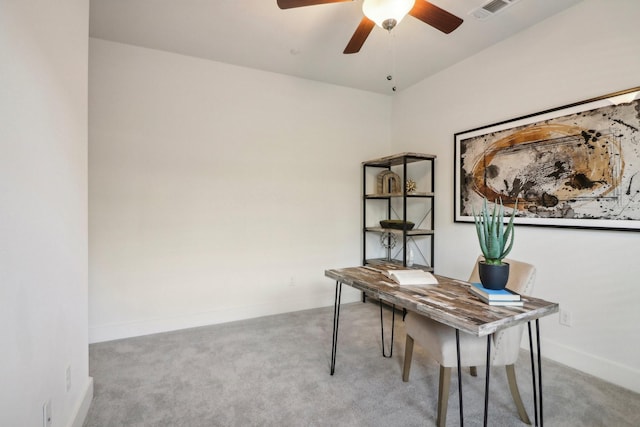 carpeted home office with ceiling fan