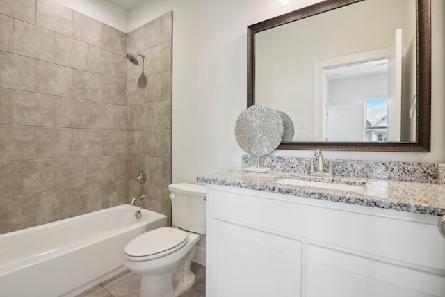 full bathroom featuring tiled shower / bath combo, vanity, tile patterned floors, and toilet