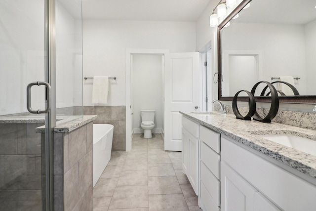 full bathroom featuring vanity, tile patterned flooring, plus walk in shower, and toilet