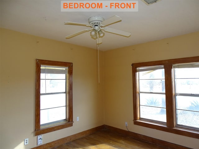 spare room featuring ceiling fan and wood-type flooring