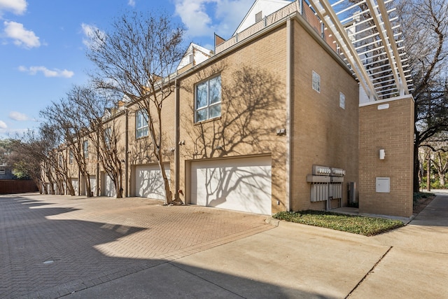 view of side of property featuring a garage