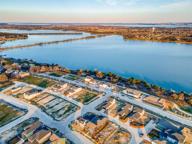 aerial view at dusk with a water view