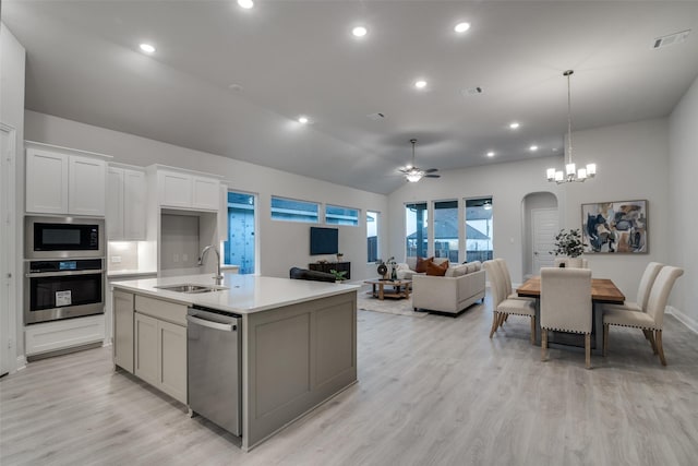 kitchen featuring sink, ceiling fan, an island with sink, white cabinetry, and stainless steel appliances