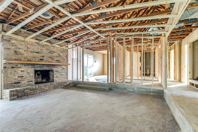 misc room with a brick fireplace