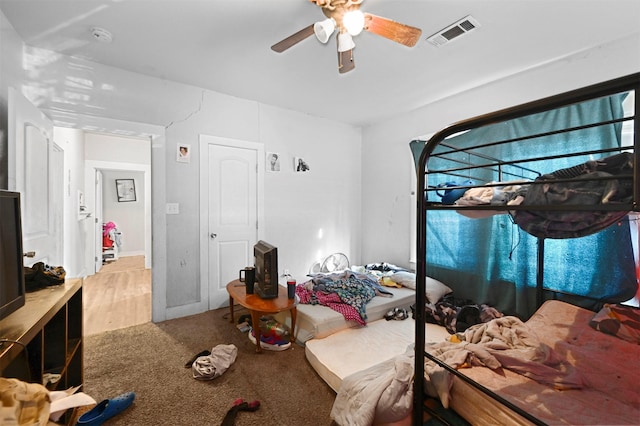 carpeted bedroom featuring ceiling fan