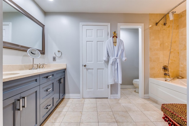 full bathroom with vanity, toilet, and tiled shower / bath