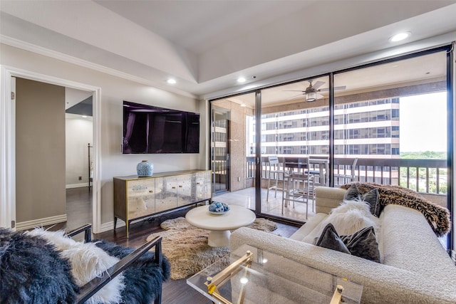 living room with ceiling fan and hardwood / wood-style flooring