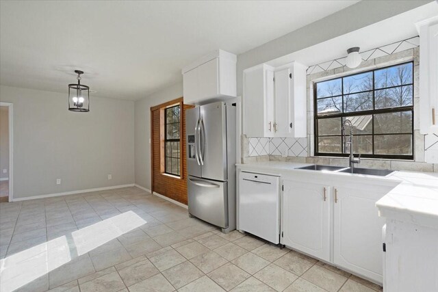 kitchen with dishwasher, stainless steel fridge with ice dispenser, white cabinets, and decorative light fixtures