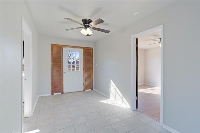 foyer with ceiling fan