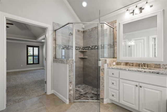 bathroom featuring a shower with door, ceiling fan, lofted ceiling, crown molding, and vanity