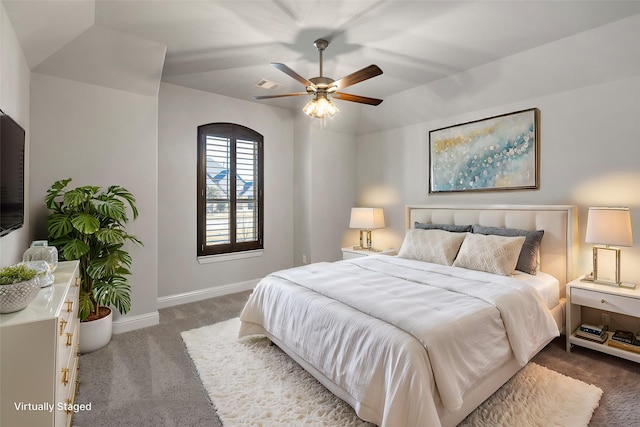 bedroom with ceiling fan, carpet, and lofted ceiling