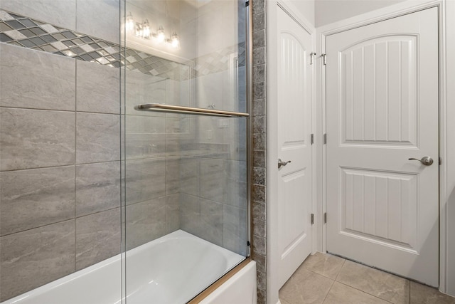 bathroom with enclosed tub / shower combo and tile patterned flooring