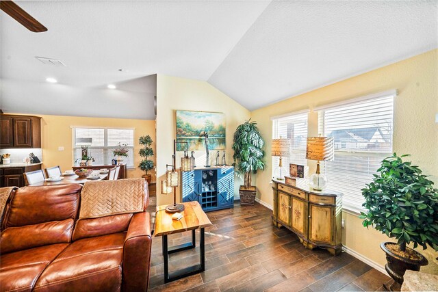 kitchen featuring decorative backsplash, light stone countertops, dark hardwood / wood-style flooring, stainless steel appliances, and sink